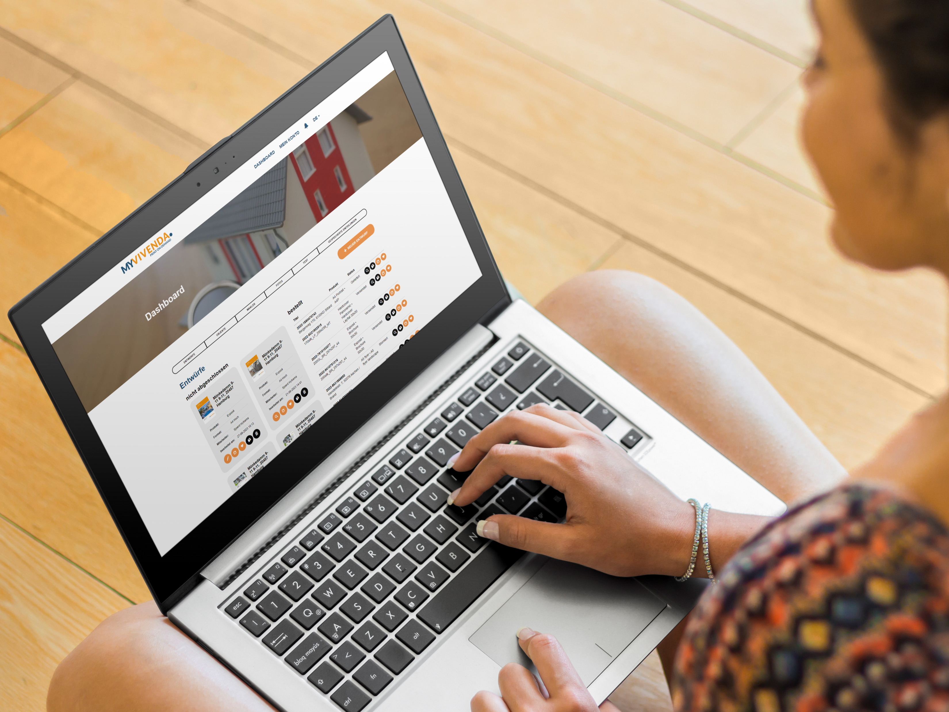 girl-using-pc-laptop-on-wooden-floor-mockup-generator