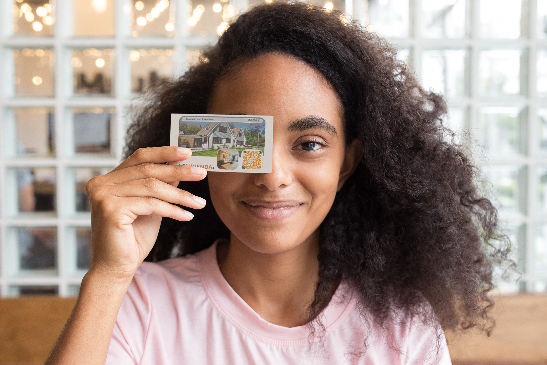 mockup-of-a-girl-holding-a-business-card-against-her-face-21922